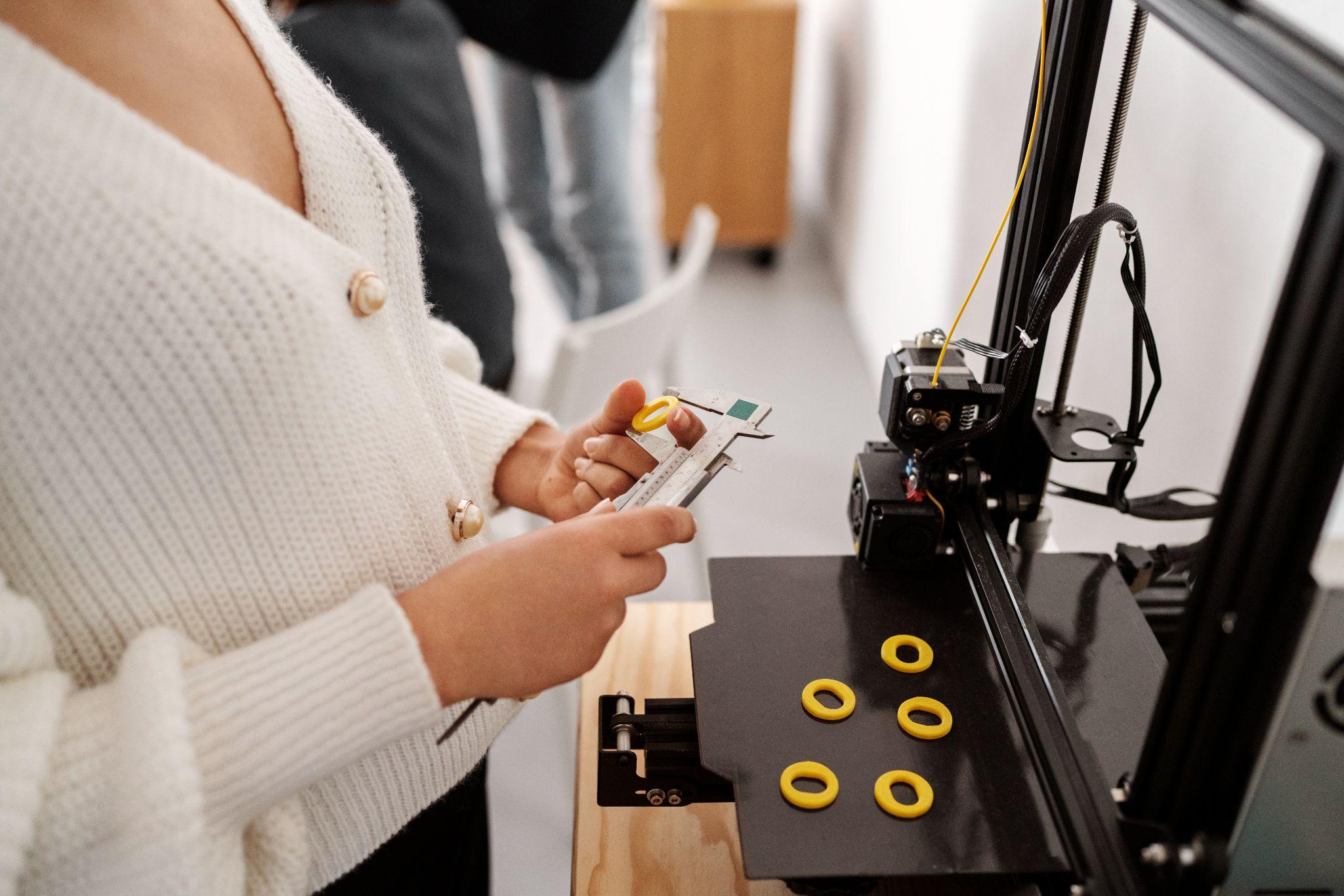 Close up look of female designer working on 3d printing