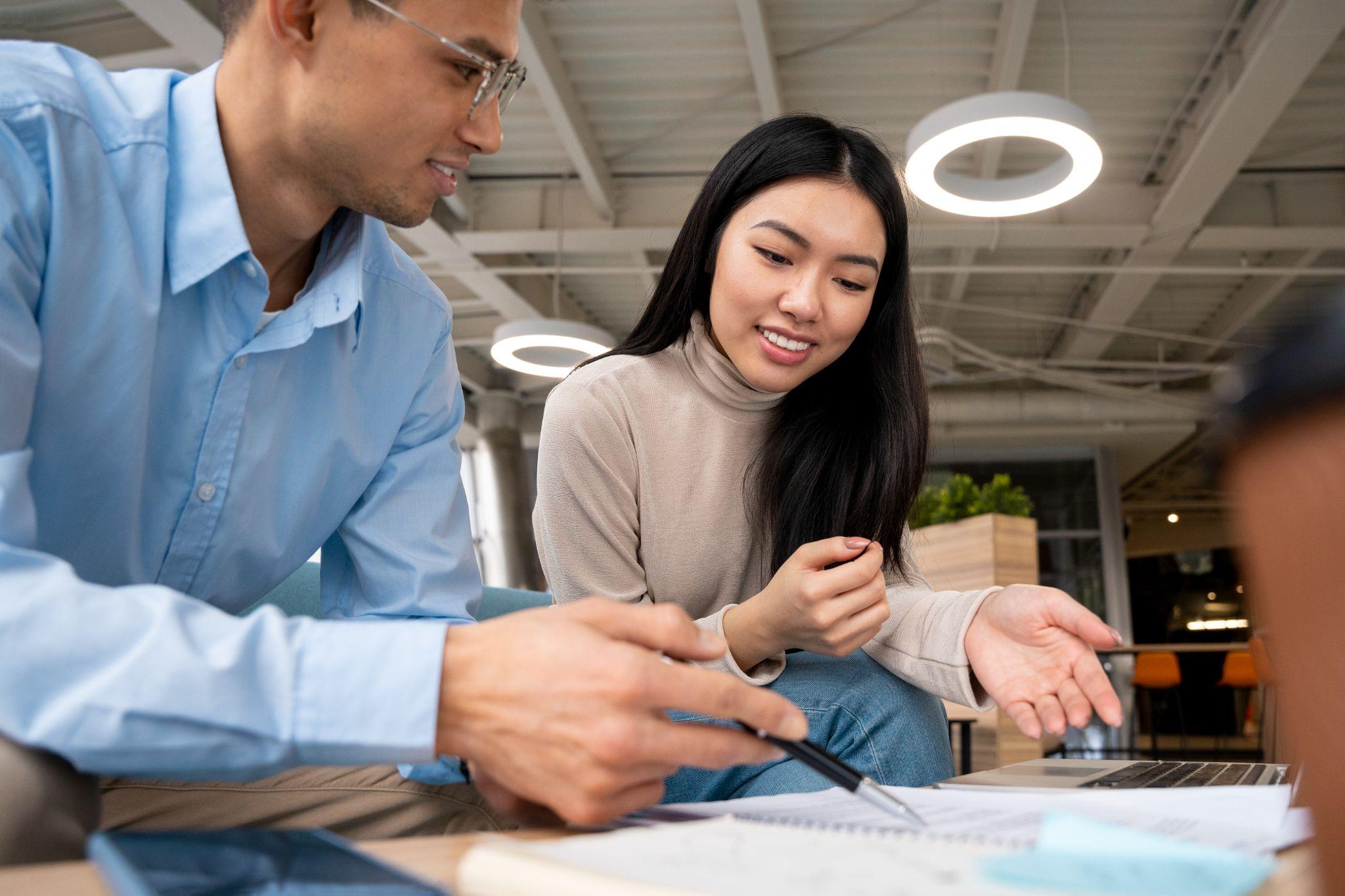 asian business people making a deal in casual wear