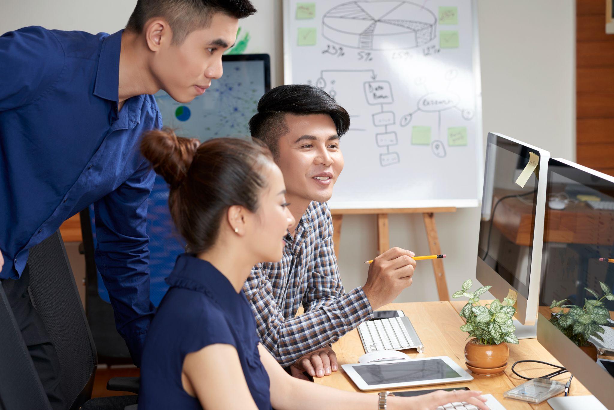 Asian business team having a discussion at work
